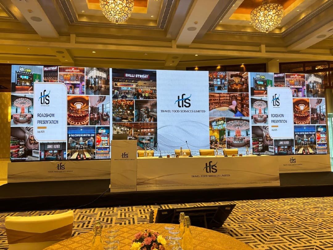 IPO listing ceremony stage with executives at a podium